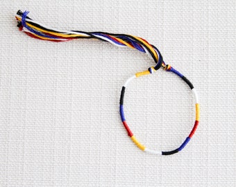 Friendship Bracelet Yellow Blue Black White and Red Embroidery Threads / Stocking Stuffer