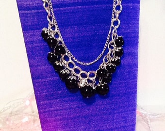 Silver chain with black beads