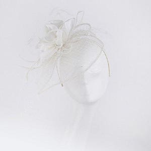 Janeo Cecelia Fascinator, Voluminous Swirls Bows & Roses in Satin fabric on a wide Brim Sinamay Fabric Contoured Base, Net Veil - Off White