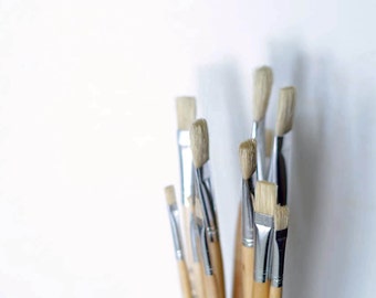 Paint brush set of 12. Flat paint brushes made of stiff hog hair with long wooden handle. Oil painting, mural painting, artist paint brushes