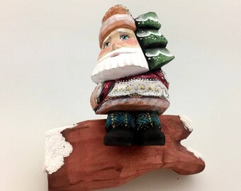 Santa Claus on timber, Christmas tree, decoration handmade and hand-painted figure, ornament for Christmas holidays and home decoration