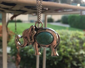 Silver Elephant with Blue Stone in Center