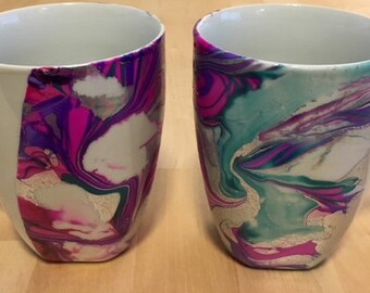 White mug pair with purple, fuchsia, green and silver marbling/dip dyed