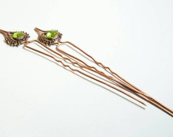 Hairpins of copper with green crystal and copper beads.