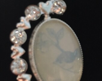 Inspirational bluebird necklace. Spinning diamonte pendant with inspirational wording