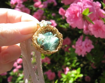Romantic enchanted feathered birdnest on lace with turquoise eggs necklace