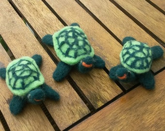 Handmade needle felted turtles.
