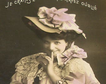 1900s French postcard, Lady with a secret, RPPC real photo postcard.