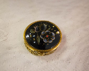 Floral black enamel mirrored round compact, with gold mesh bottom