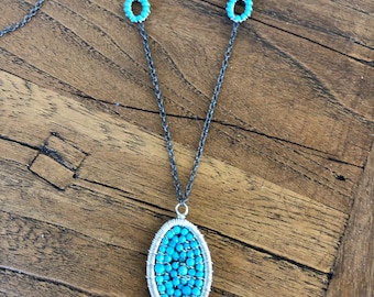 Turquoise and blackened silver pendant necklace.