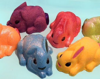 Bunny bath bombs! Colorful and glittery, with environmentally safe glitter! Sets of three 6+ ounce bunnies, 2 sets to choose from!