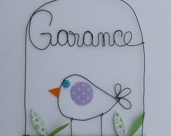 Initials wire in a bird cage