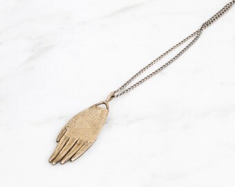 Hand amulet necklace - brass on silver