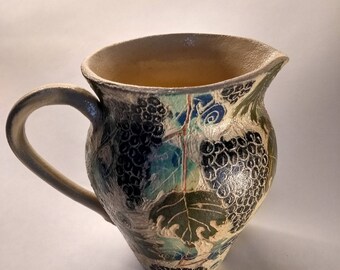 Jug with vine leaf design