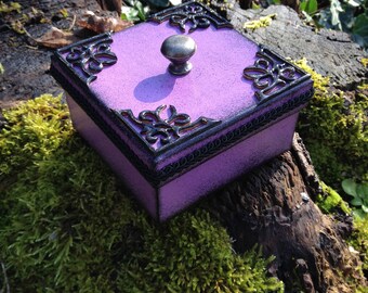 Square black and purple cardboard jewelry box