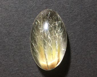 Rutilated quartz high dome cabochon 13 x 22 x 11 mm