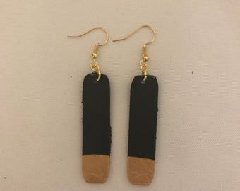 Black and gold tipped earrings