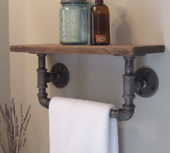 Industrial pipe hand towel rack with wood shelf.