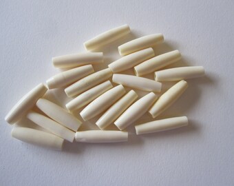 20 bone hair pipe beads - approx 7/8 inch long