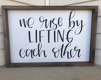 Inspirational Sign - We Rise By Lifting Each Other