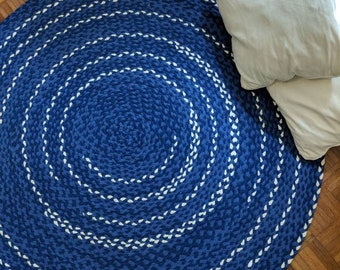 Indigo blue braided rug with off white accents