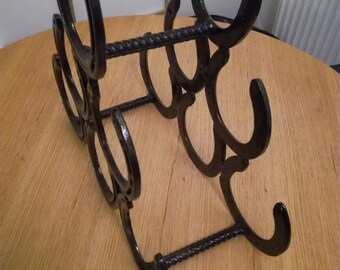 Horse shoe wine rack, gloss black.