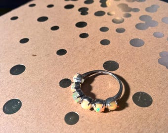 Delicate sterling silver ring with opal-like stones