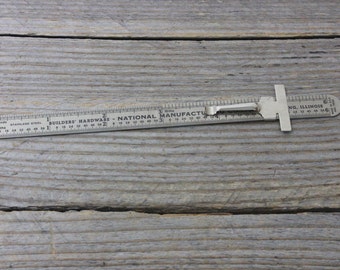 6-inch metal ruler with shirt clip. Vintage advertising: Builders' Hardware National Manufacturing Company, Sterling, Illinois