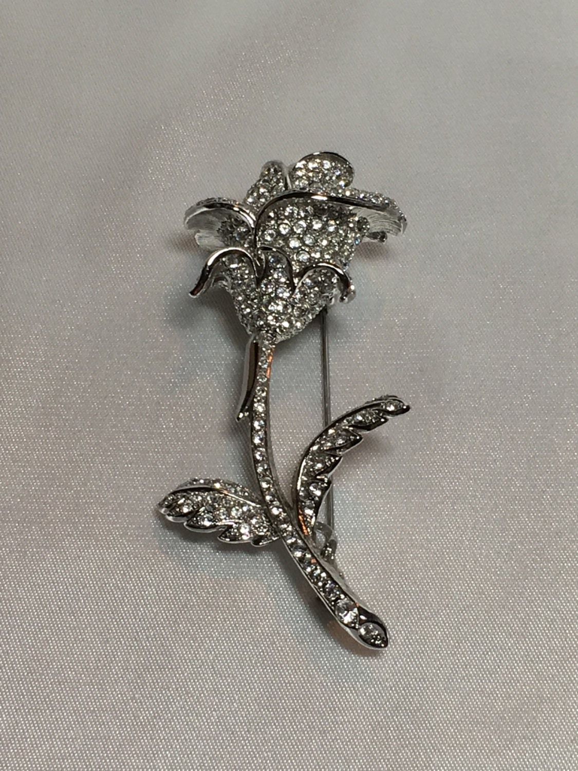 nolan miller rose brooch