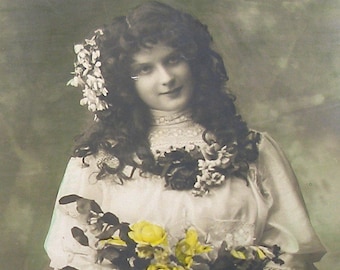 1900s French postcard, Lady with yellow flowers. RPPC real photo postcard.