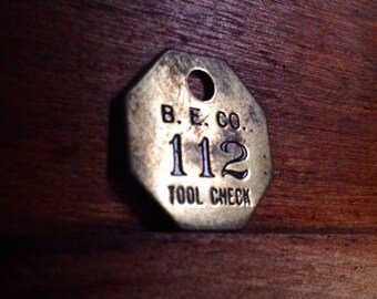 Vintage Brass B. E. Co. Tool Check Tag. Number 112. Industrial Craft Supplies.