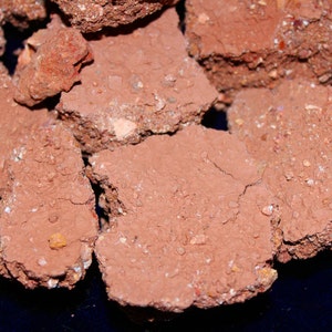 Earthy clay dirt chunks with multicolor clay pieces throughout. Pure and edible clay soil
