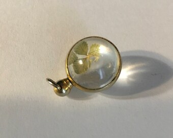 Antique 10k gold pools of light pendant with four leaf clover as found