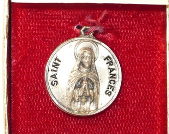 Vintage Creed sterling St. Frances medal in original box.