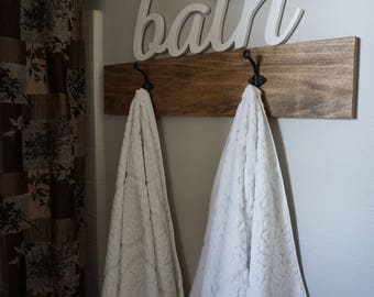 Rustic wood with iron towel hooks