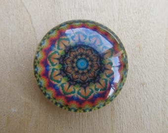 Glass cabochon round 25 mm in diameter with background scenery kaleidoscope image.
