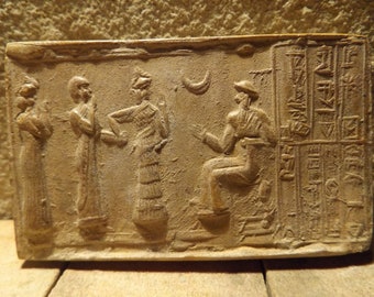 Sumerian cylinder seal of Ur Nammu. Museum replica tablet. Mesopotamian art.