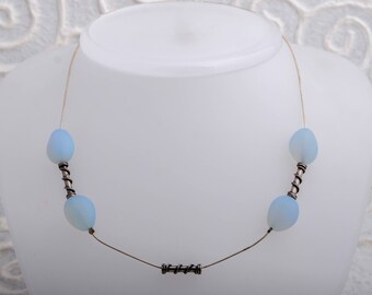 silver necklace with white opal beads