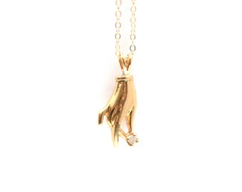 14k Figural Hand Holding Diamond Pendant