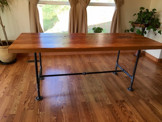 Reclaimed wood and pipe table. Industrial table. Black iron
