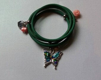 Childerens leather wrap bracelet with charms.