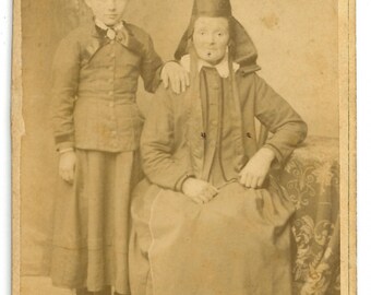 CDV of a young girl and an old woman wearing traditional German headdress / carte de visite, German. Punzmüssen