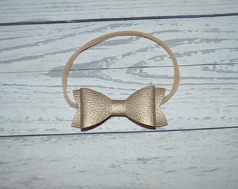 Gold or black leather bow