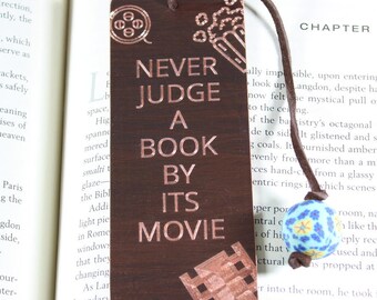 Never judge a book by its movie, antiqued copper bookmark, antiqued brass bookmark