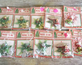 Lot of 10 Vintage Plastic Christmas Package Tie-ons. Mr & Mrs. Clause and Greenery.