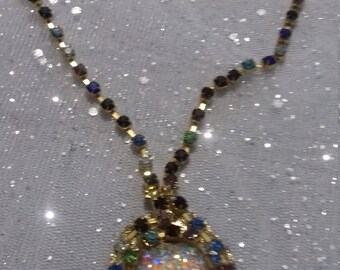 string with multi-colored stones and heart