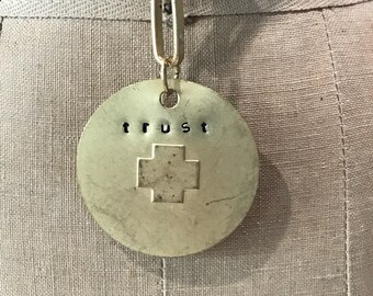 Trust stamped brushed gold metal necklace