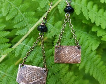 Handmade etched copper earrings.