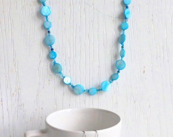 Set of long necklace and earrings with blue shell beads and seed beads