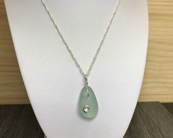 Silver ammonite and sea glass pendant
